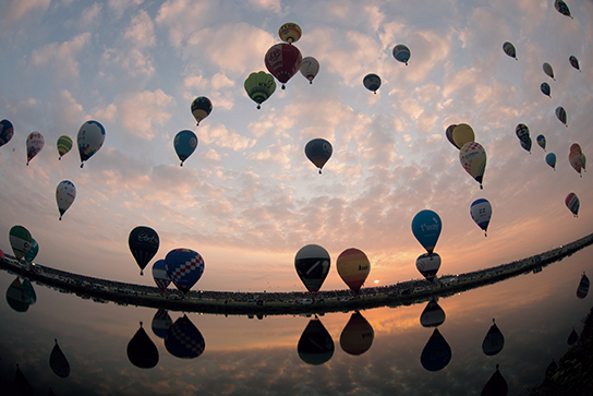 Balloons in sky with cloud details