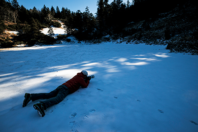Low angle, low position shot of snow with bokeh circles