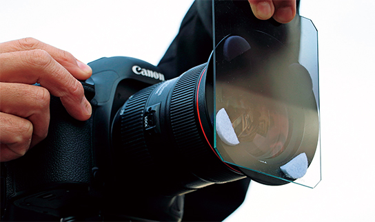Holding GND filter over lens