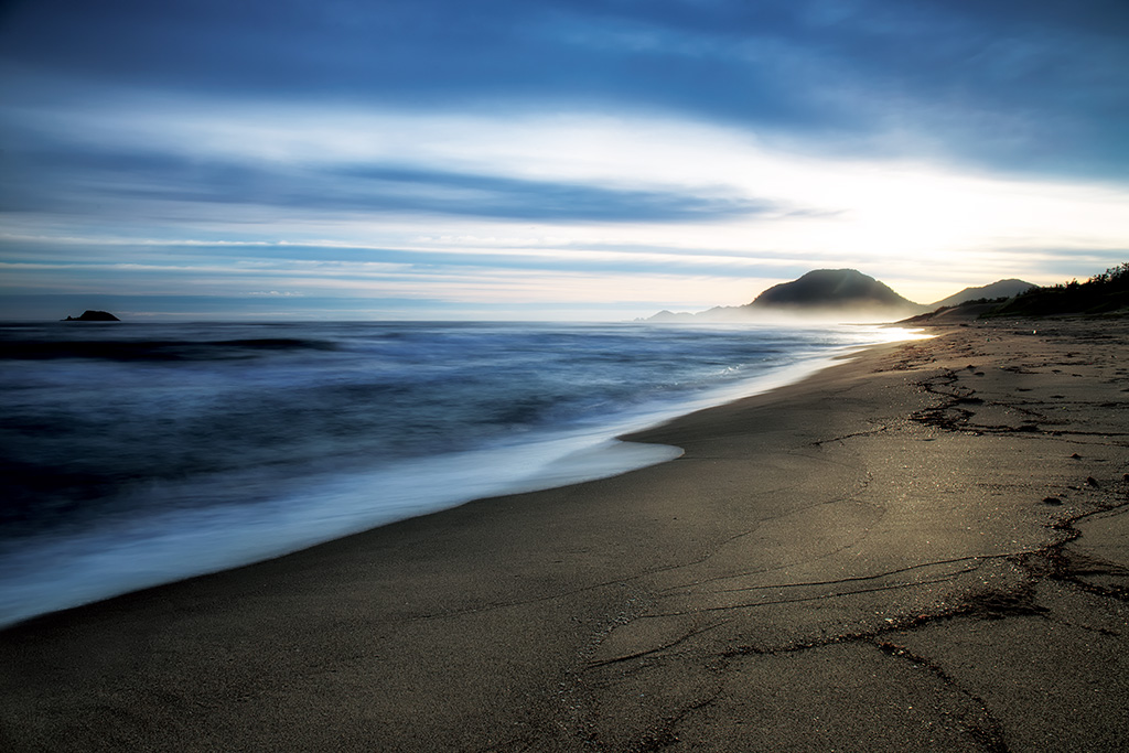 Flowing clouds over seashore