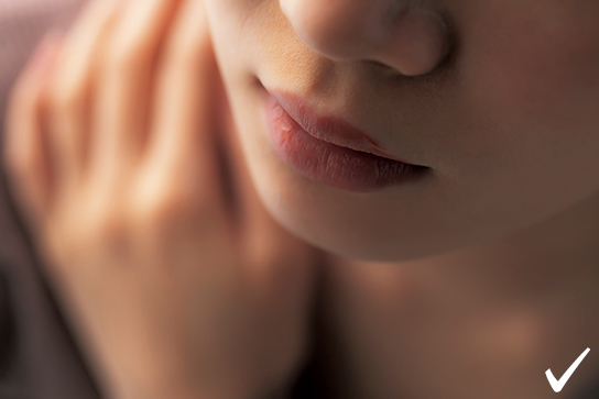 Close up of lips and jaw, shot from an angle