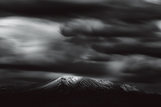 Dramatic dark clouds over mountain