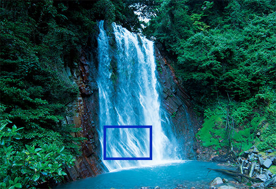 Wide-angle view of waterfall and surroundings