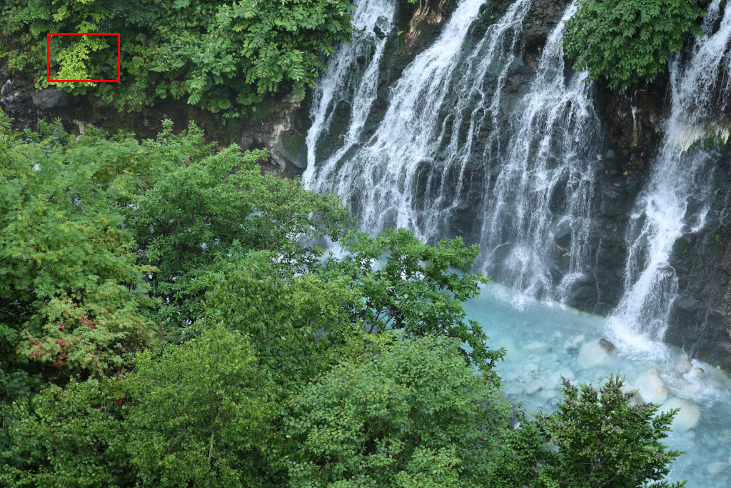 Telephoto landscape with waterfall